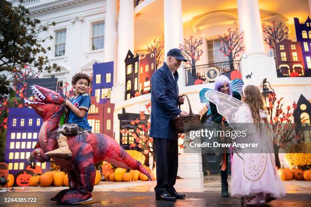 President Joe Biden and first lady Jill Biden greet trick-or-treaters during a Halloween event on the South Lawn of the White House October 31, 2022...