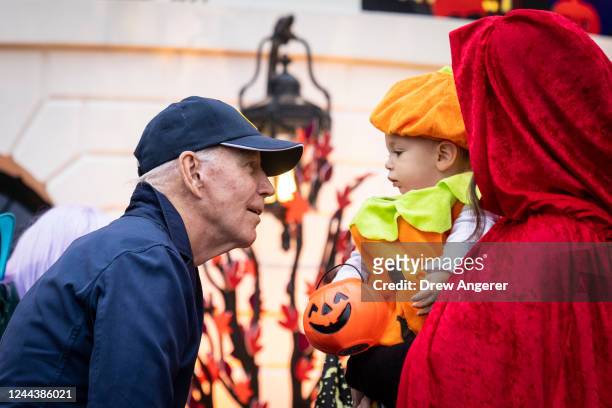 President Joe Biden greets trick-or-treaters during a Halloween event on the South Lawn of the White House October 31, 2022 in Washington, DC. The...