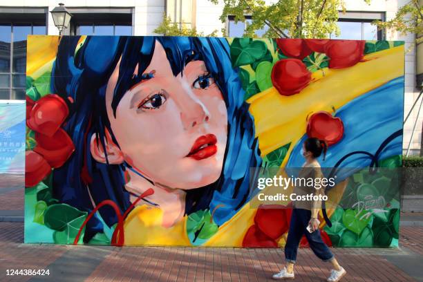 Visitors visit the "Montmartre Paris - Li Gongdi Suzhou" street painting art exhibition in Suzhou, Jiangsu province, China, Oct 31, 2022. Recently,...