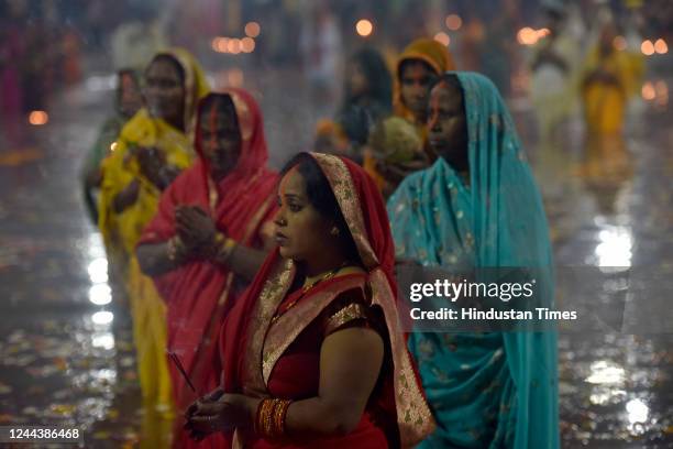 Devotees perform rituals on Chhath Puja at Noida stadium on October 31, 2022 in Noida, India. Thousands of devotees celebrating Chhath Puja gathered...