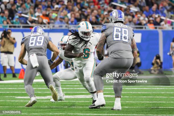 Miami Dolphins linebacker Melvin Ingram rushes against Detroit Lions offensive tackle Taylor Decker during an NFL football game between the Miami...