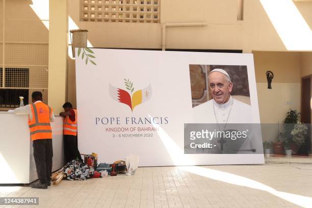 Poster bearing the image of Pope Francis is displayed at the Sacred Heart Church in the capital Manama, on October 7 ahead of a visit by the pontiff...