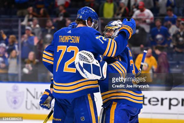 Tage Thompson of the Buffalo Sabres celebrates with Eric Comrie after an NHL game against the Detroit Red Wings on October 31, 2022 at KeyBank Center...