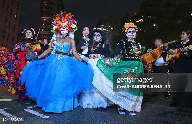 Revellers march in costumes during the 49th Annual Halloween parade in Greenwich Village, New York on October 31, 2022.