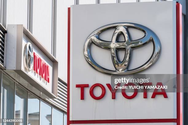 This picture taken on October 31, 2022 shows the logo of Toyota Motor displayed at a car showroom in Tokyo. - Toyota will release second quarter...