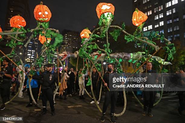 Revellers march in costumes during the 49th Annual Halloween parade in Greenwich Village, New York on October 31, 2022.