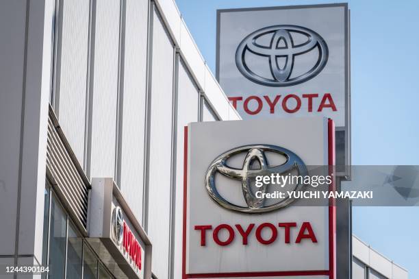 This picture taken on October 31, 2022 shows the logo of Toyota Motor displayed at a car showroom in Tokyo. - Toyota will release second quarter...