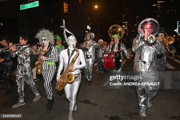 Revellers march in costumes during the 49th Annual Halloween parade in Greenwich Village, New York on October 31, 2022.