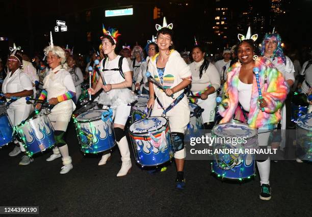 Revellers march in costumes during the 49th Annual Halloween parade in Greenwich Village, New York on October 31, 2022.