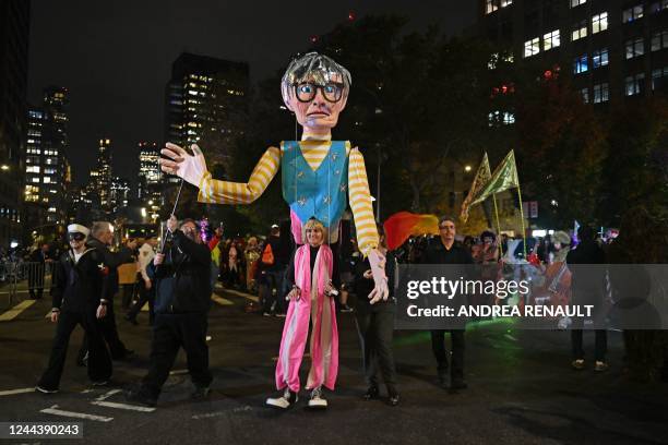 Revellers march in costumes during the 49th Annual Halloween parade in Greenwich Village, New York on October 31, 2022.