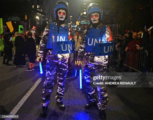 Revellers march in costumes during the 49th Annual Halloween parade in Greenwich Village, New York on October 31, 2022.