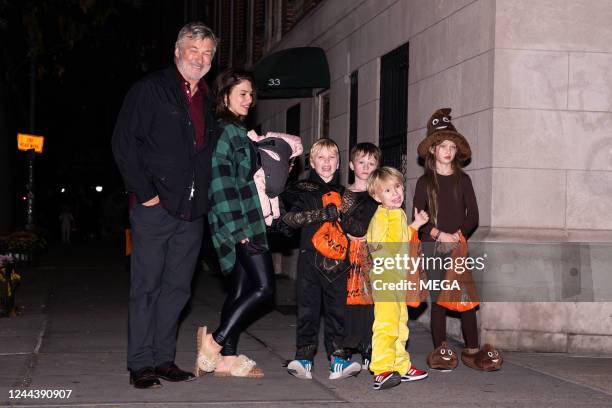 Alec Baldwin and Hilaria Baldwin are seen trick-or-treating with their children on October 31, 2022 in New York.