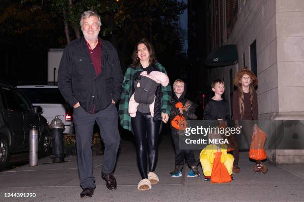 Alec Baldwin and Hilaria Baldwin are seen trick-or-treating with their children on October 31, 2022 in New York.