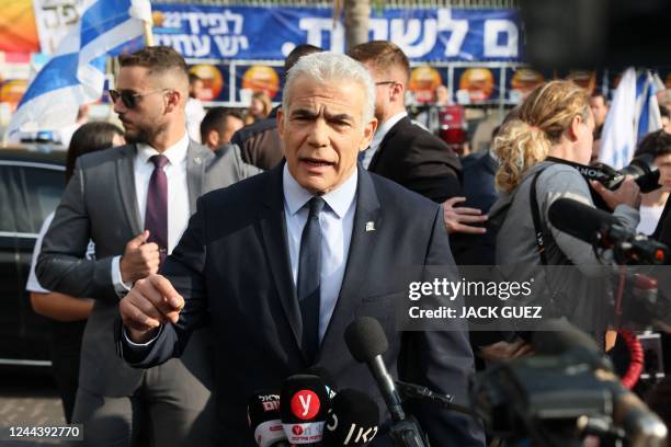 Israeli Prime Minister Yair Lapid address the media outside a polling station in Israel's coastal city of Tel Aviv after casting his vote in the...