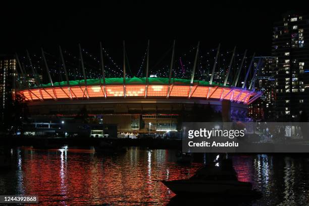 An aerial view of BC Place, lit up in orange for Halloween in Vancouver, British Columbia, Canada on October 31, 2022.