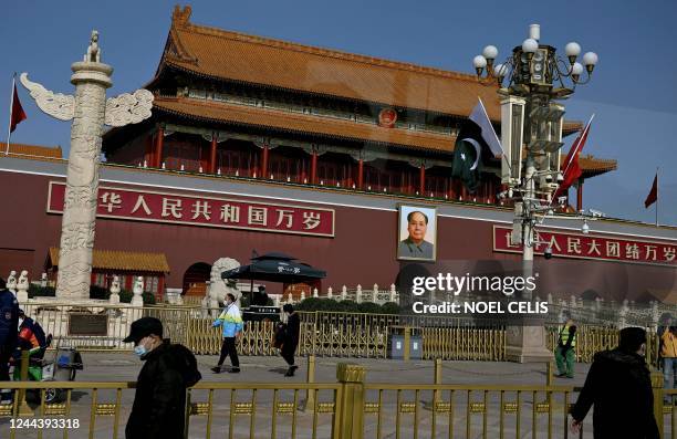 The Pakistan and Chinese national flags are seen together near the Tiananmen Gate in Beijing on November 1, 2022. - Pakistan Prime Minister Shahbaz...