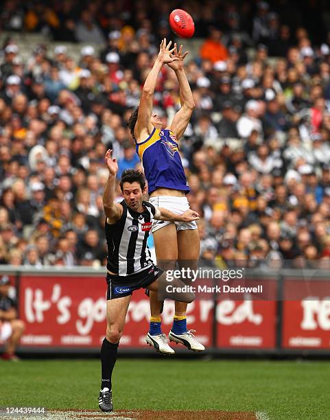 Andrew Embley of the Eagles marks over Alan Didak of the Magpies during the AFL First Qualifying match between the Collingwood Magpies and the West...