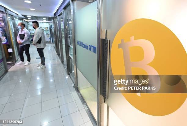 Logo of the digital currency Bitcoin is pictured on an ATM in a mall in Hong Kong on November 1, 2022. - In contrast to mainland China where crypto...