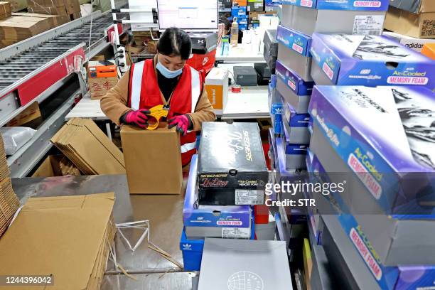An employee packages items for delivery ahead of the Singles' Day shopping festival which falls on November 11, at Tianma E-commerce Industrial Park...