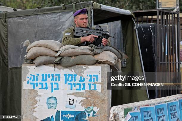 An ISraeli soldier is deployed at a position near Kiryat Arba in the occupied West Bank on the outskirts of Hebron on November 1, 2022. - Israelis...