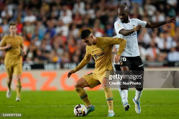 Ferran Torres left winger of Barcelona and Spain and Dimitri Foulquier Right-Back of Valencia and Guadeloupe controls the ball during the La Liga...