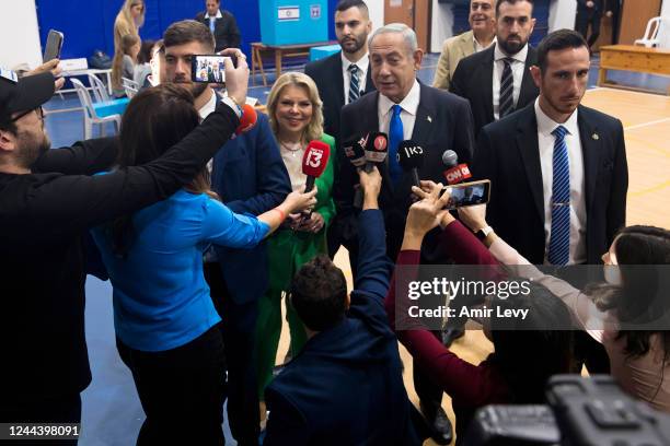 Former Israeli Prime Minister and Likud party leader Benjamin Netanyahu and his wife Sara Netanyahu speak to the press after casting their vote in...