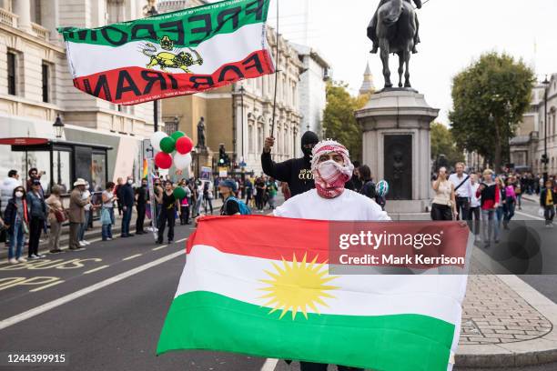 Demonstrators wave Iranian and Kurdistan flags during a human chain protest in solidarity with demonstrators across Iran on 29 October 2022 in...