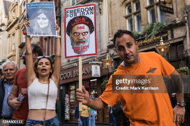 Demonstrators hold up signs during a human chain protest in solidarity with protesters across Iran on 29 October 2022 in London, United Kingdom....