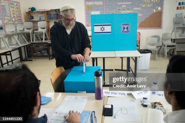 An Israeli man casts his vote during Israel's general elections on November 1, 2022 in Har Homa, Israel. Israelis return to the polls on November 1...