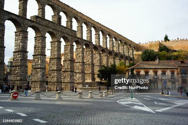 Segovia, Castilla y Leon, october 29 of 2022: Tourists visit ancient Roman Aqueduct. This monument was builtd in the beginings of II Century, between...