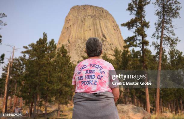 Sheridan, WY A woman paused to take in the view of Devils Tower as she hiked along the trail that surrounds it.