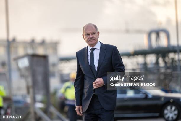 German Chancellor Olaf Scholz arrives for a press statement after visiting the construction site of the cathode materials factory of German chemicals...
