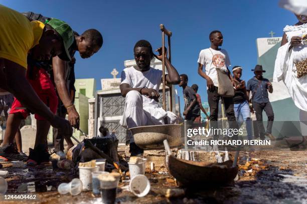Haitians celebrate Fèt Gede, the Festival of the Dead, at the National Cemetery in Port-au-Prince, on November 1, 2022. - Fèt Gede is an annual...