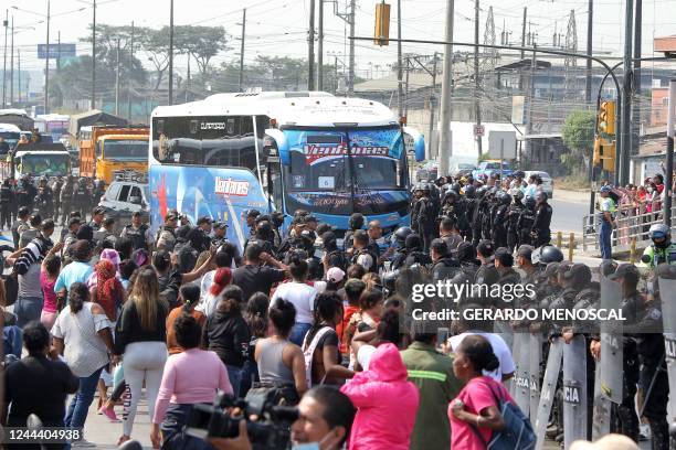 National Police forces escort a bus transferring inmates from the Guayas 1 prison complex in Guayaquil, Ecuador, on November 1, 2022. - Two police...