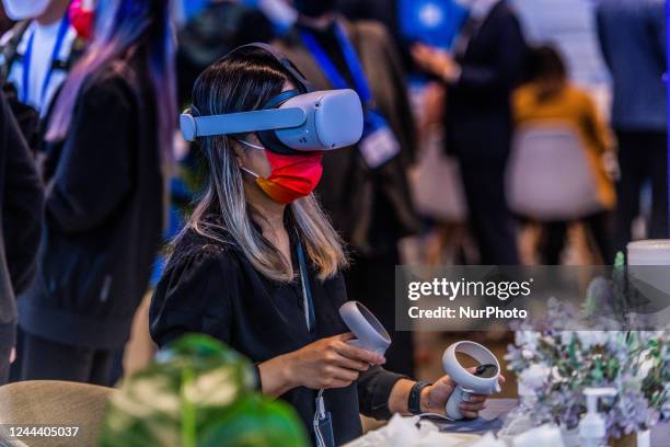 Participant to the Fintech Week tests virtual reality on the Meta stand, in Hong Kong, on November 01, 2022.