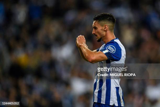 Porto's Canadian midfielder Stephen Eustaquio celebrates after scoring his team's second goal during the UEFA Champions League 1st round Group B...