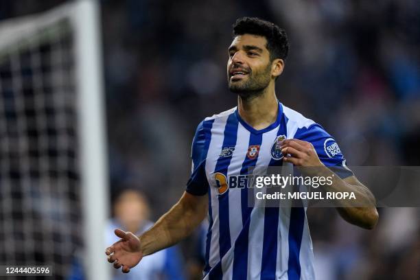 Porto's Iranian forward Mehdi Taremi celebrates after scoring his team's first goal during the UEFA Champions League 1st round Group B football match...