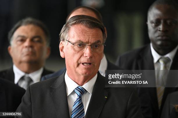 Brazilian President Jair Bolsonaro makes a statement for the first time since Sunday's presidential run-off election, at Alvorada Palace in Brasilia,...