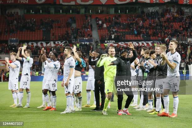 Club Brugge's team celebrates after the end of the UEFA Champions League Group B football match Bayer 04 Leverkusen vs Club Brugge in Leverkusen,...