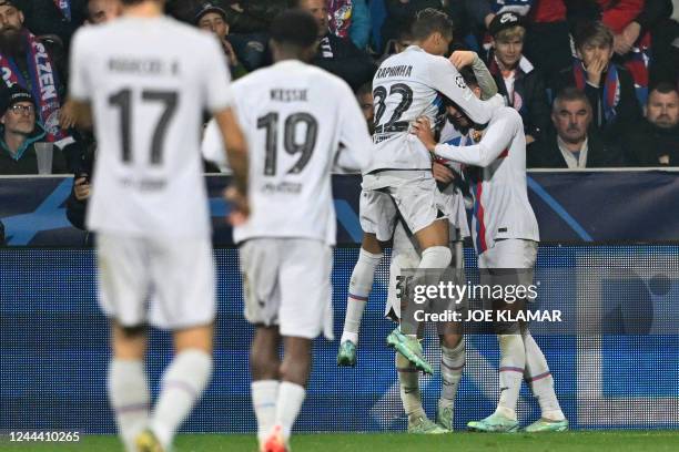 Barcelona's players celebrate the 3-1 goal scored by Barcelona's Spanish forward Ferran Torres during the UEFA Champions League Group C football...