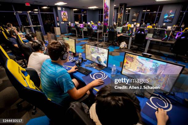 Irvine, CA Bruno Mobest, center in blue shirt, joins fellow UCI students playing in the Overwatch 2 competition game at the Arena at UC Irvine...