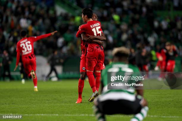 Evan NDicka of Frankfurt and Daichi Kamada celebrate the victory at the end of the UEFA Champions League Group D football match between Sporting CP...