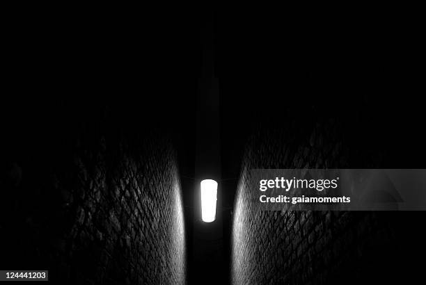 light in the darkness - narrow stock pictures, royalty-free photos & images