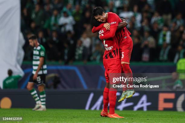 Evan NDicka and Daichi Kamada of Eintracht Frankfurt celebrates wining the UEFA Champions League group D match between Sporting CP and Eintracht...