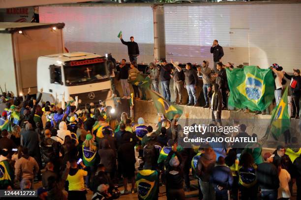 Supporters of President Jair Bolsonaro demonstrate during a partial blockade on Castelo Branco highway, on the outskirts of Sao Paulo, Brazil, on...