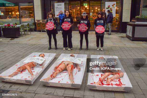 Activists seen packaged as Free-range human meat during a protest outside Whole Foods store next to Piccadilly Circus on World Vegan Day to highlight...