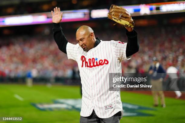 Former Phillies player Shane Victorino takes the field for the ceremonial first pitch prior to Game 3 of the 2022 World Series between the Houston...