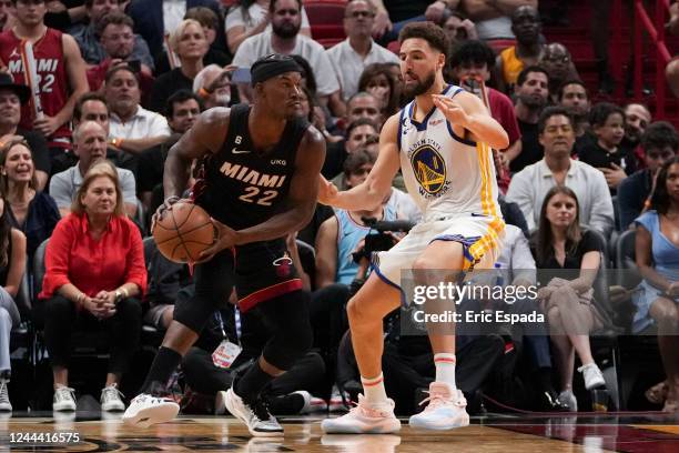 Jimmy Butler of the Miami Heat is defended by Klay Thompson of the Golden State Warriors during the second half at FTX Arena on November 1, 2022 in...