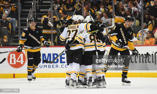 Taylor Hall of the Boston Bruins celebrates with teammates after scoring a goal in the third period during the game against the Pittsburgh Penguins...