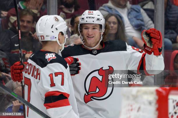 Dawson Mercer of the New Jersey Devils is congratulated by Yegor Sharangovich after scoring a goal against the Vancouver Canucks during the second...